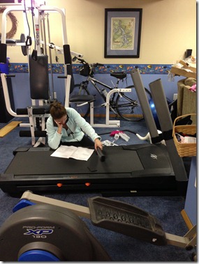 mom putting treadmill together